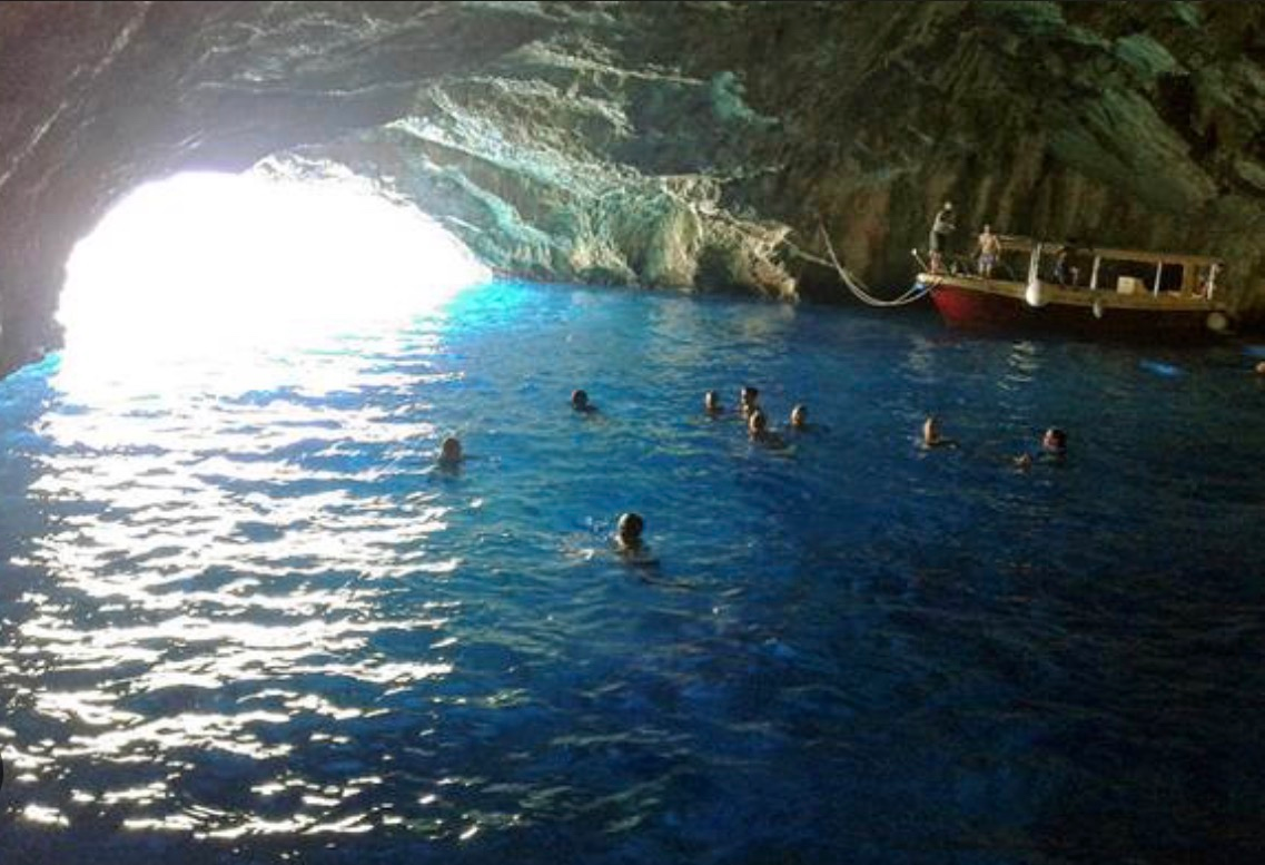 Blue Cave Montenegro with glowing blue water inside the sea cave