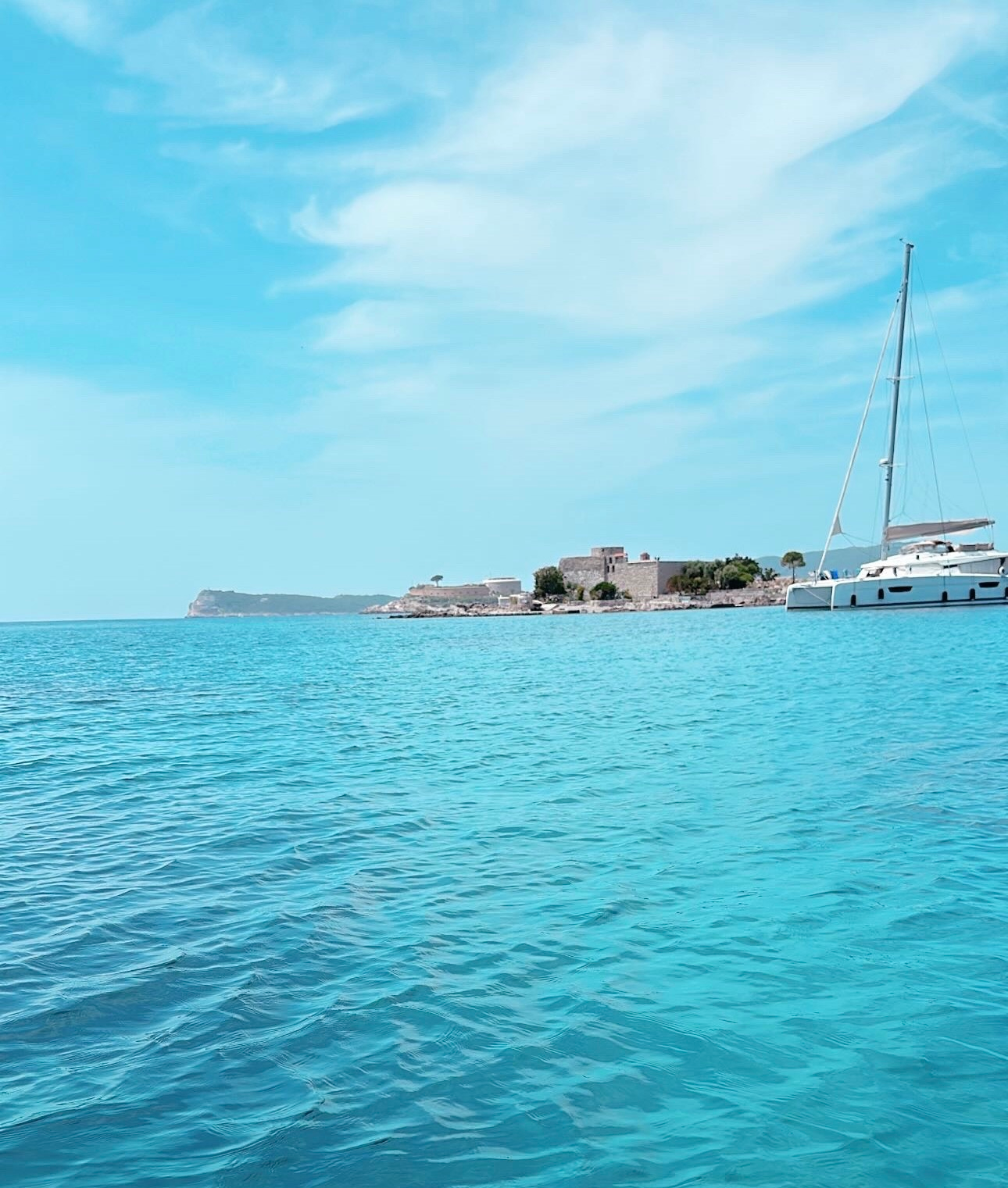 Zanjic Beach turquoise water and pine trees on Montenegro Adriatic coast